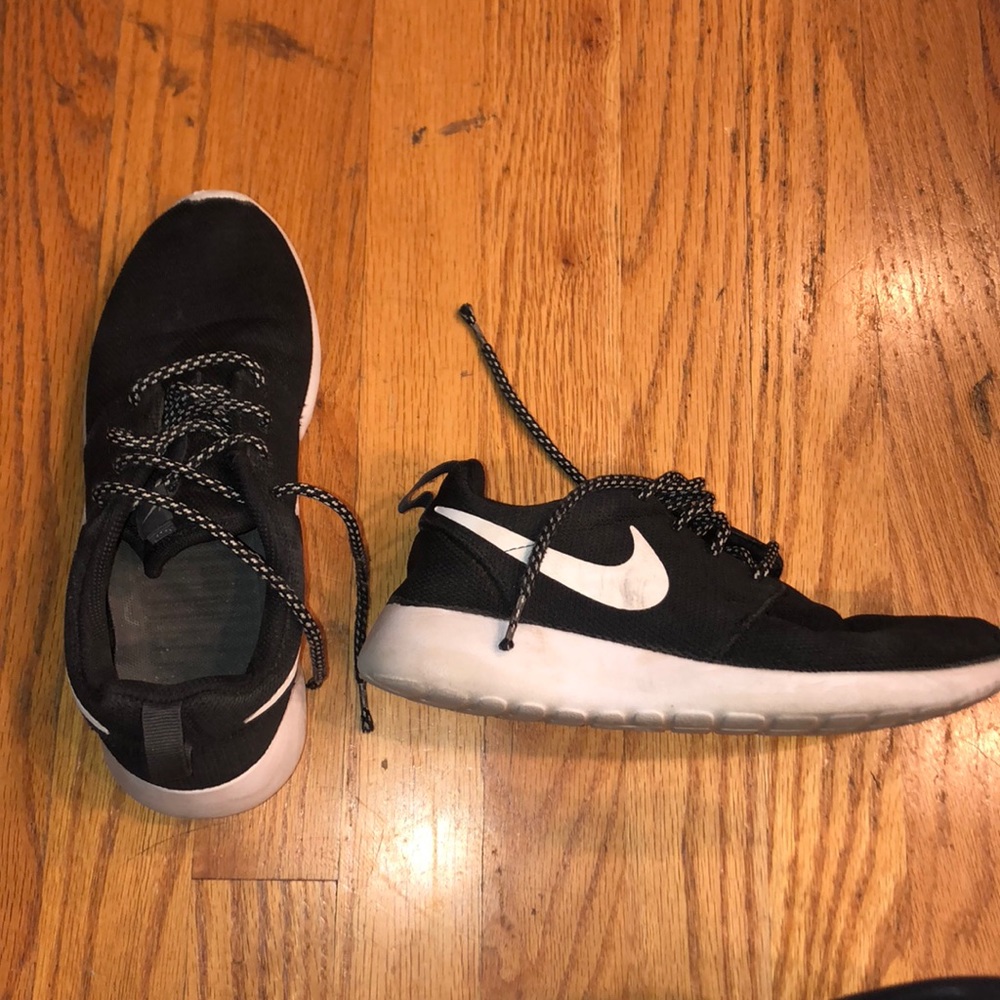 Black Nike Roches with black and white laces.